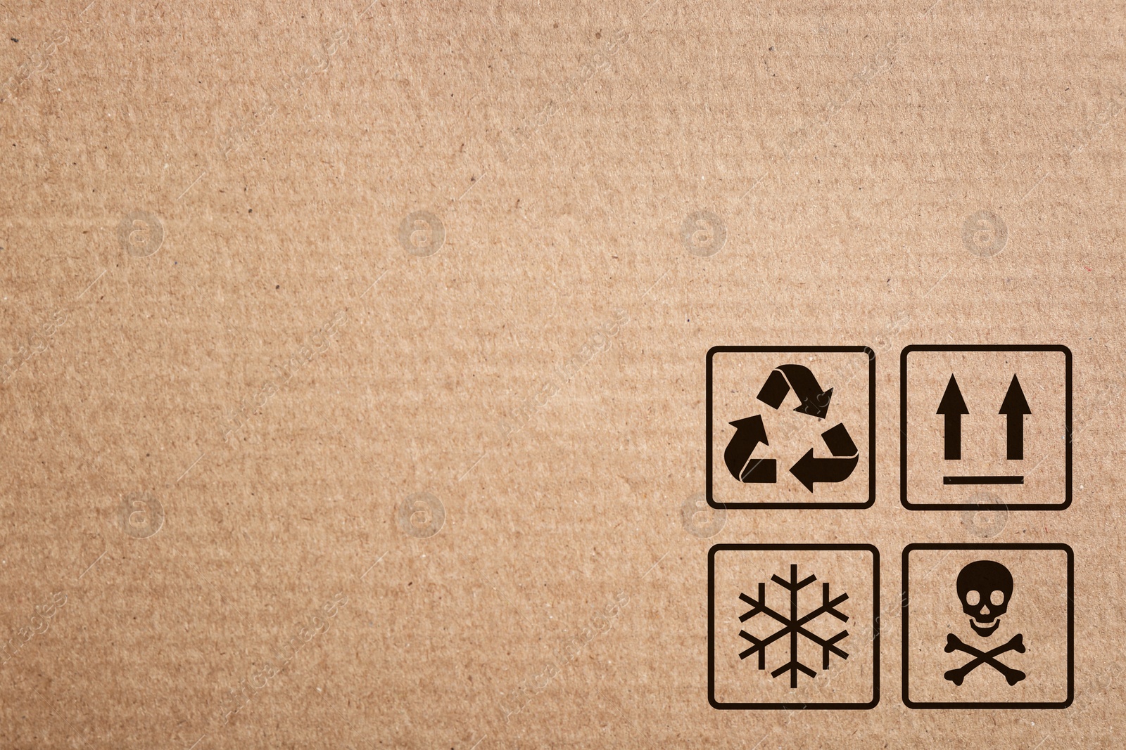 Image of Cardboard box with packaging symbols as background, closeup