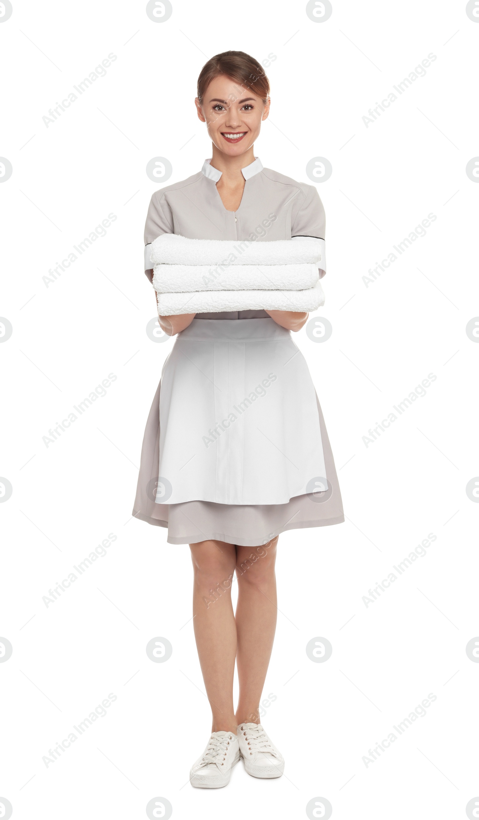 Photo of Full length portrait of chambermaid with towels on white background