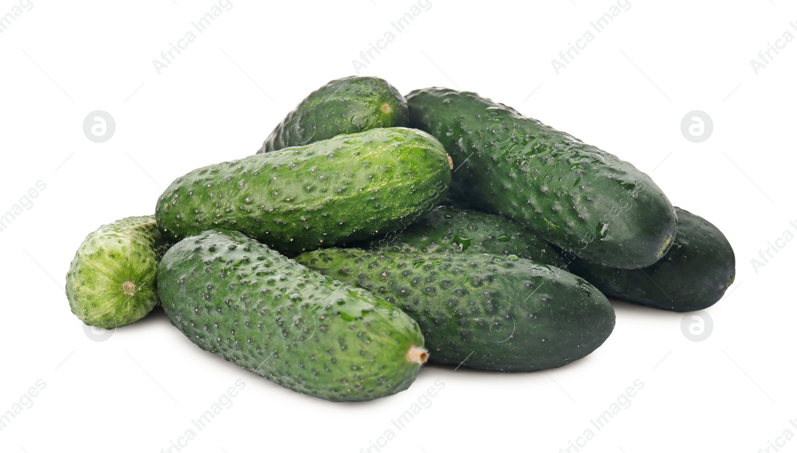 Photo of Heap of fresh ripe cucumbers on white background