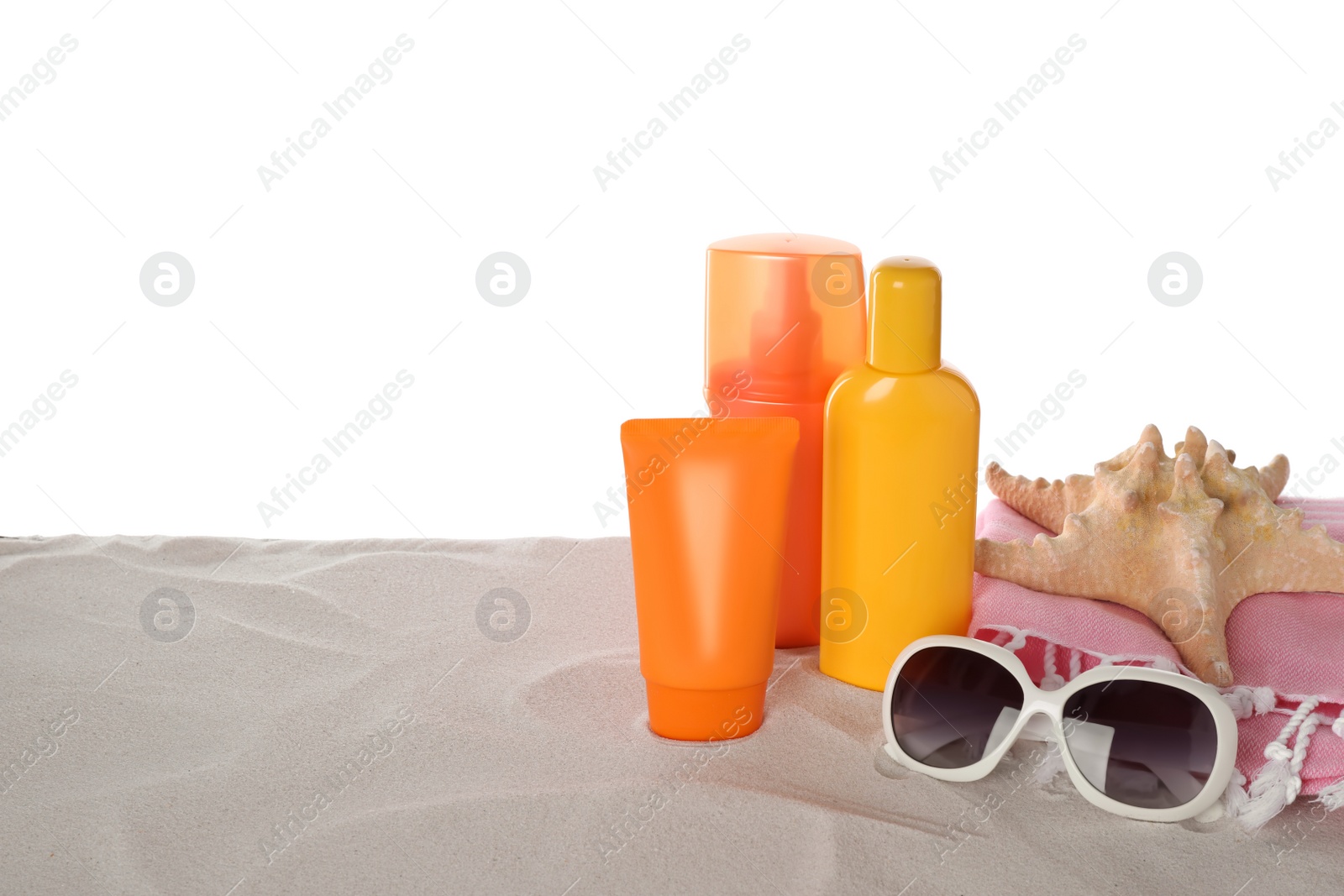 Photo of Composition with sun protection products on sand against white background. Space for text