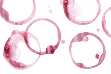 Photo of Red wine rings and drops on white background, top view