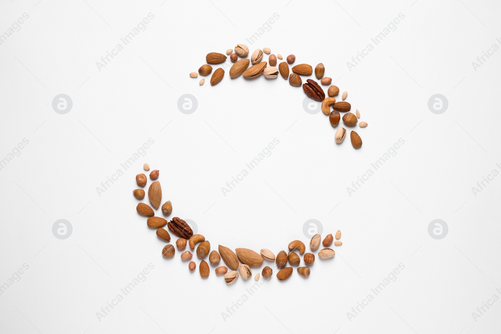 Photo of Different delicious nuts on white background, flat lay. Space for text