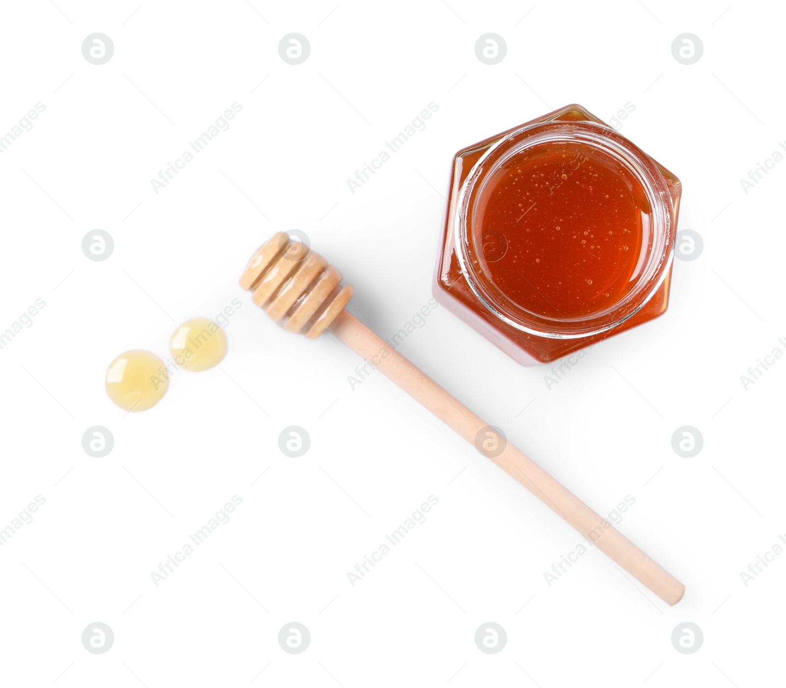 Photo of Tasty natural honey, glass jar and dipper on white background, top view