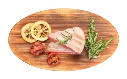 Photo of Pieces of delicious tuna steak with rosemary, tomato and lemon on white background, top view