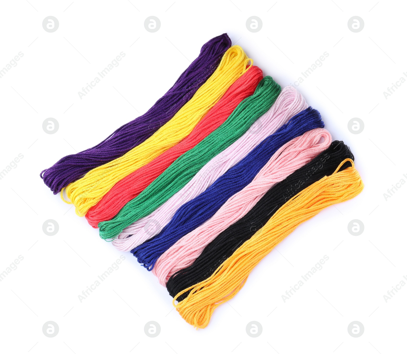 Photo of Set of colorful embroidery threads on white background, top view