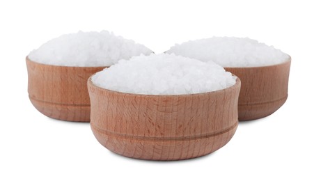Photo of Wooden bowls with natural sea salt isolated on white