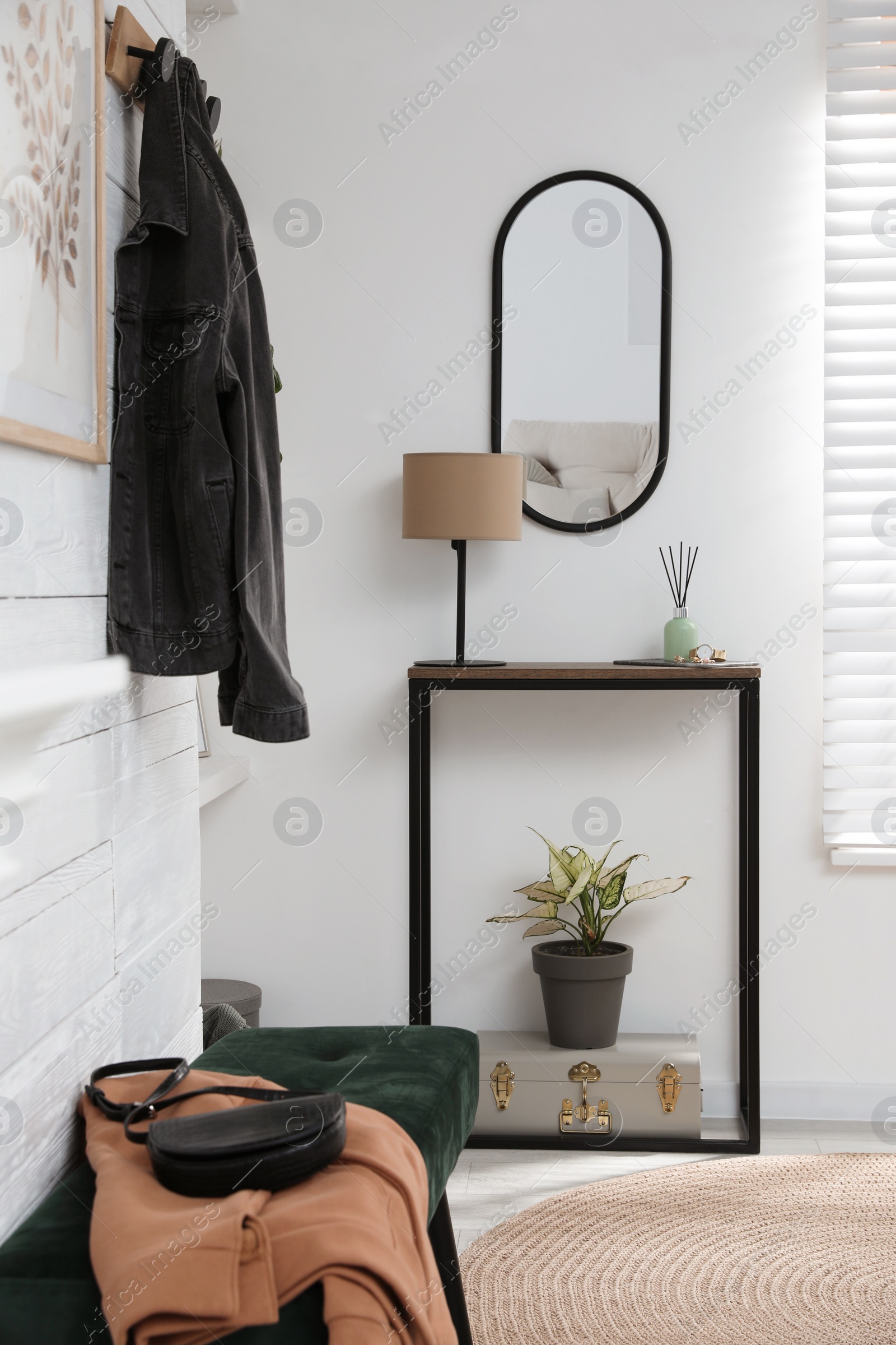 Photo of Hallway interior with console table and stylish decor