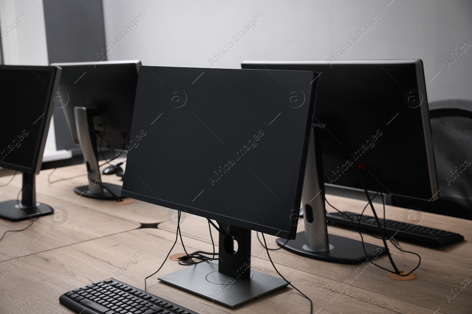 Photo of Many modern computers in open space office