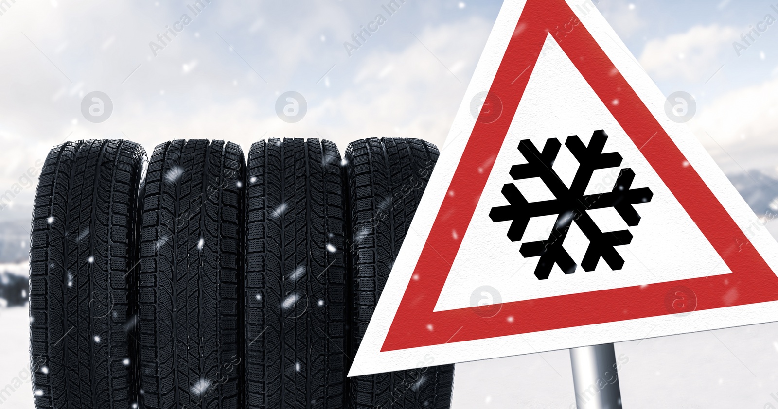 Image of Set of winter tires and road sign outdoors