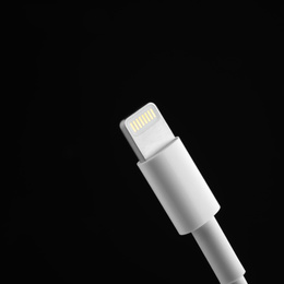 Photo of Charge cable on black background, closeup. Space for text