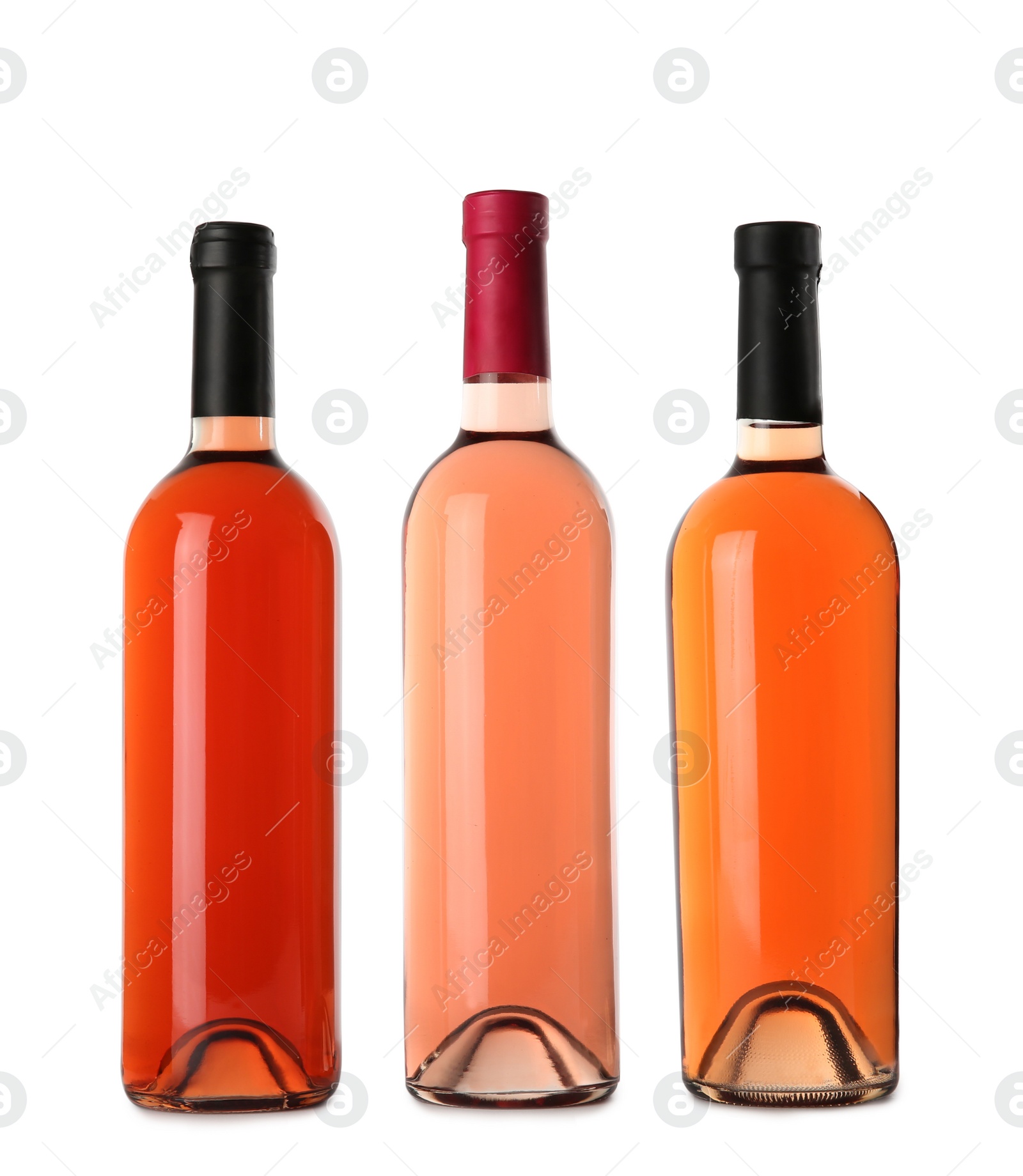 Photo of Bottles of delicious rose wine on white background. Mockup for design