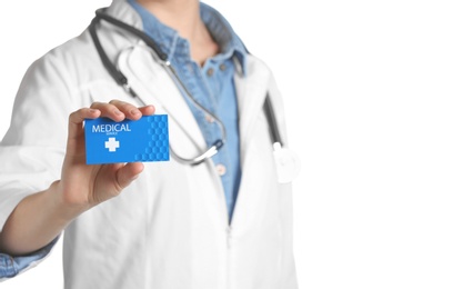 Photo of Doctor holding business card isolated on white, closeup. Medical service