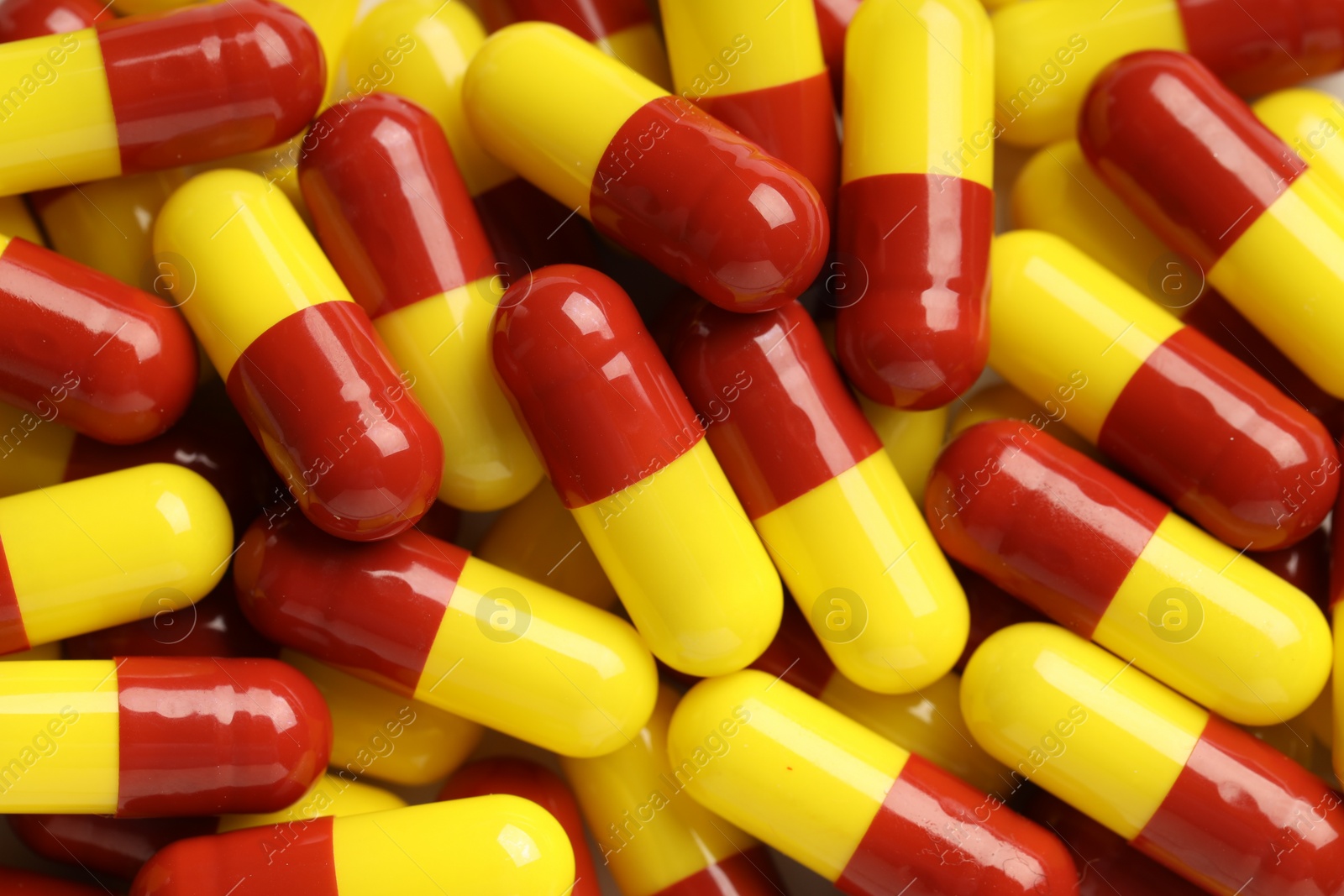 Photo of Many antibiotic pills as background, top view