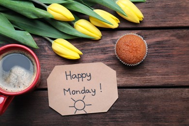 Photo of Happy Monday message, aromatic coffee, cupcake and tulips on wooden table, flat lay