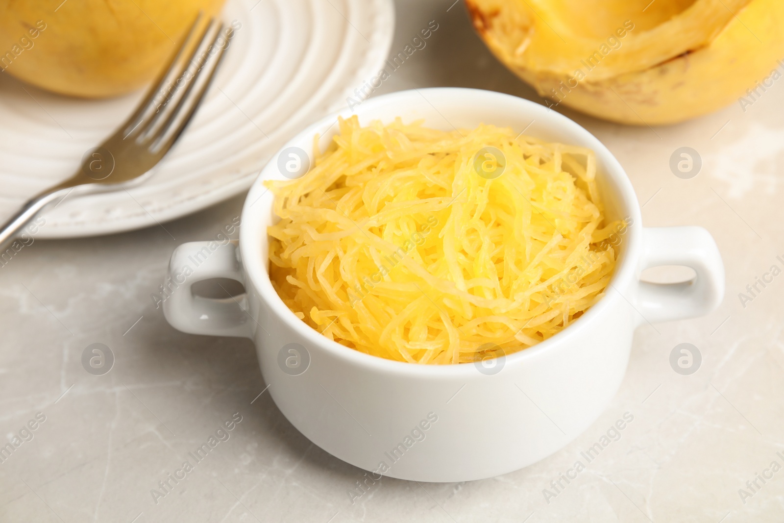 Photo of Cooked spaghetti squash in bowl served on table