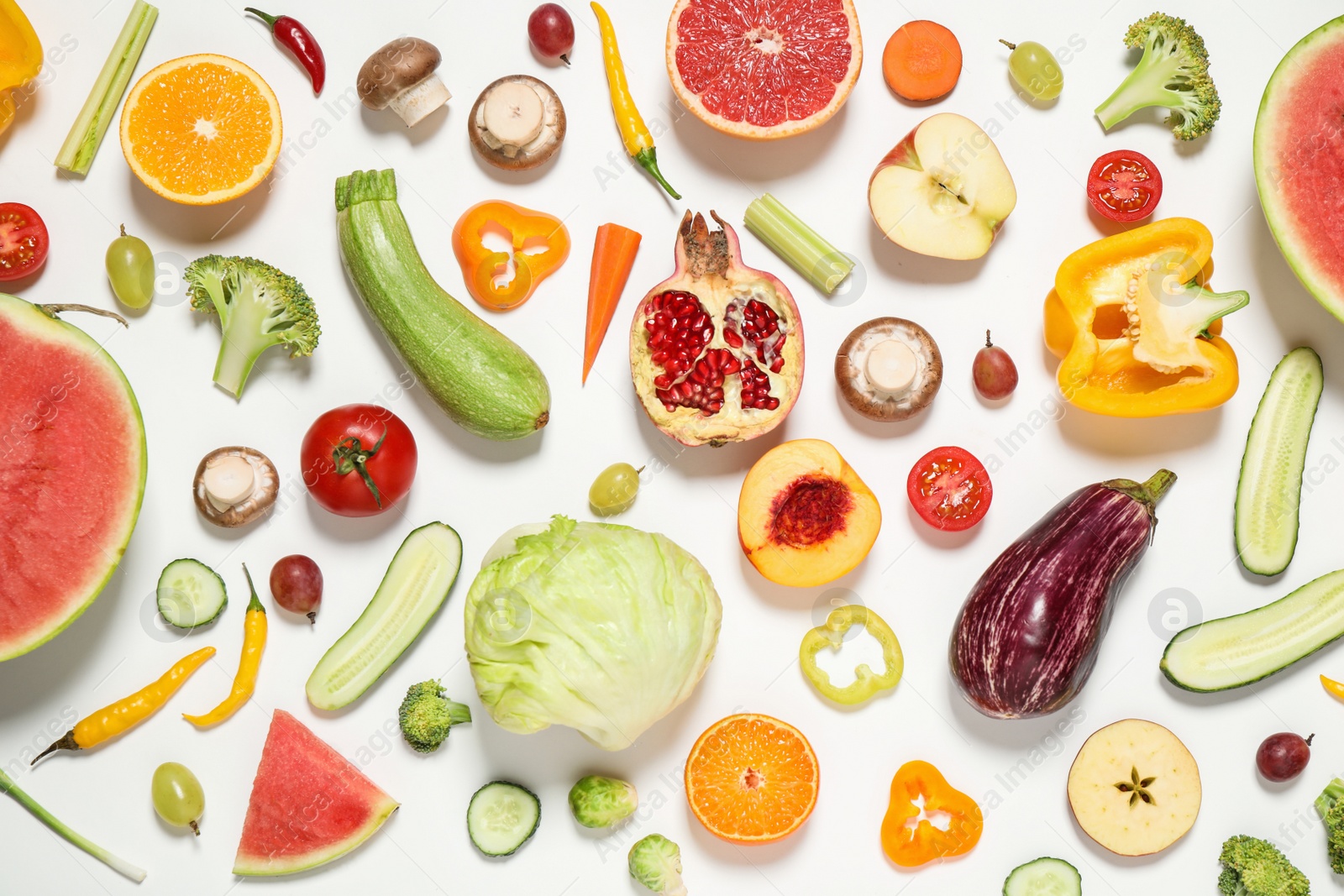 Photo of Fresh organic fruits and vegetables on white background, flat lay