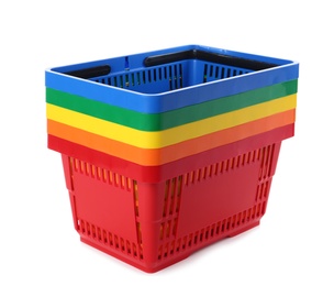 Colorful plastic shopping baskets on white background