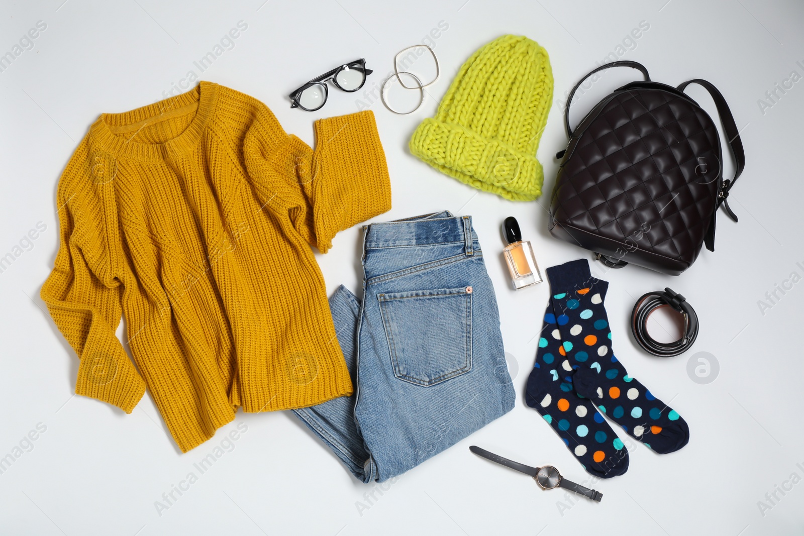 Photo of Flat lay composition with female winter clothes on white background