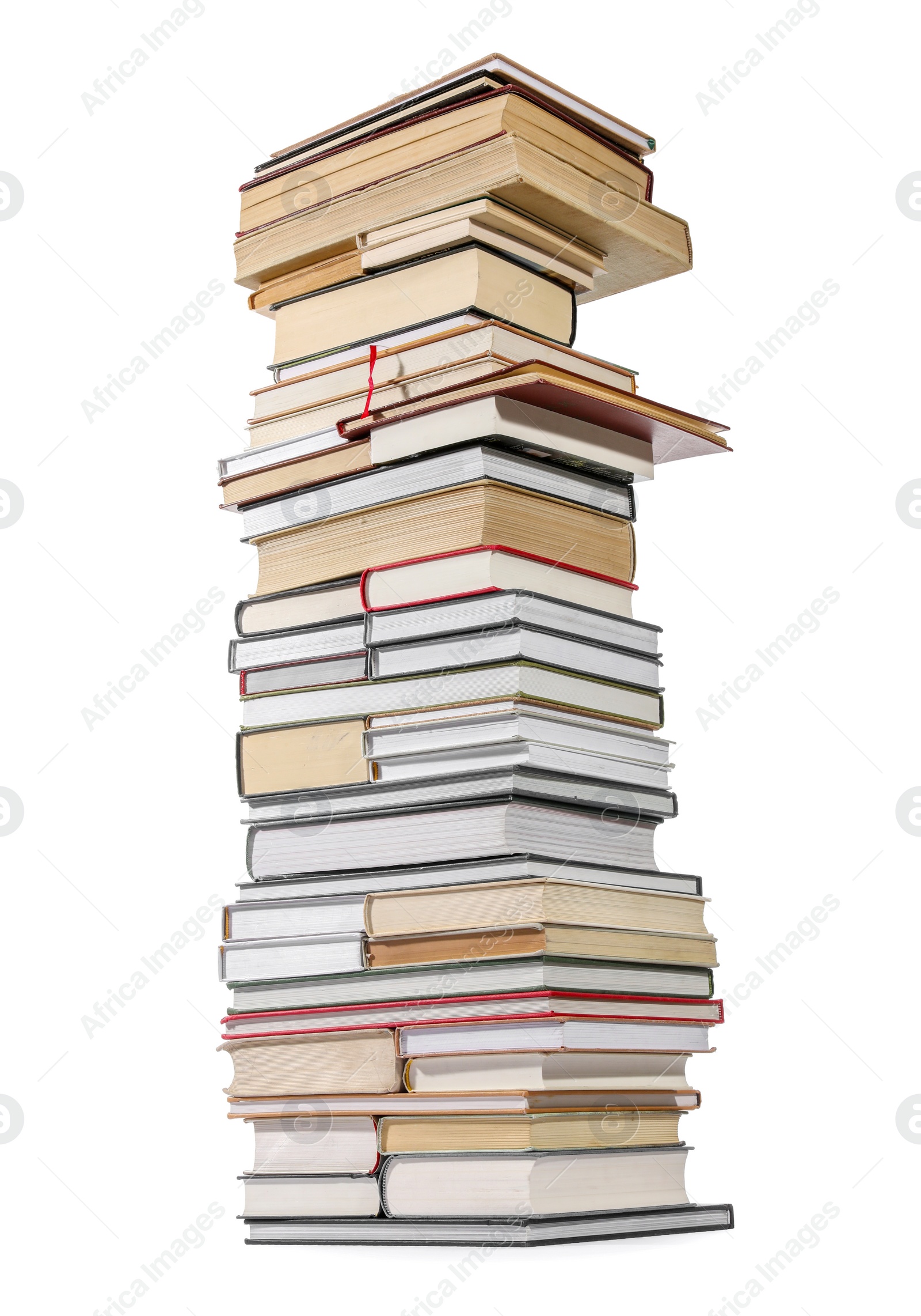 Photo of High stack of many different books isolated on white