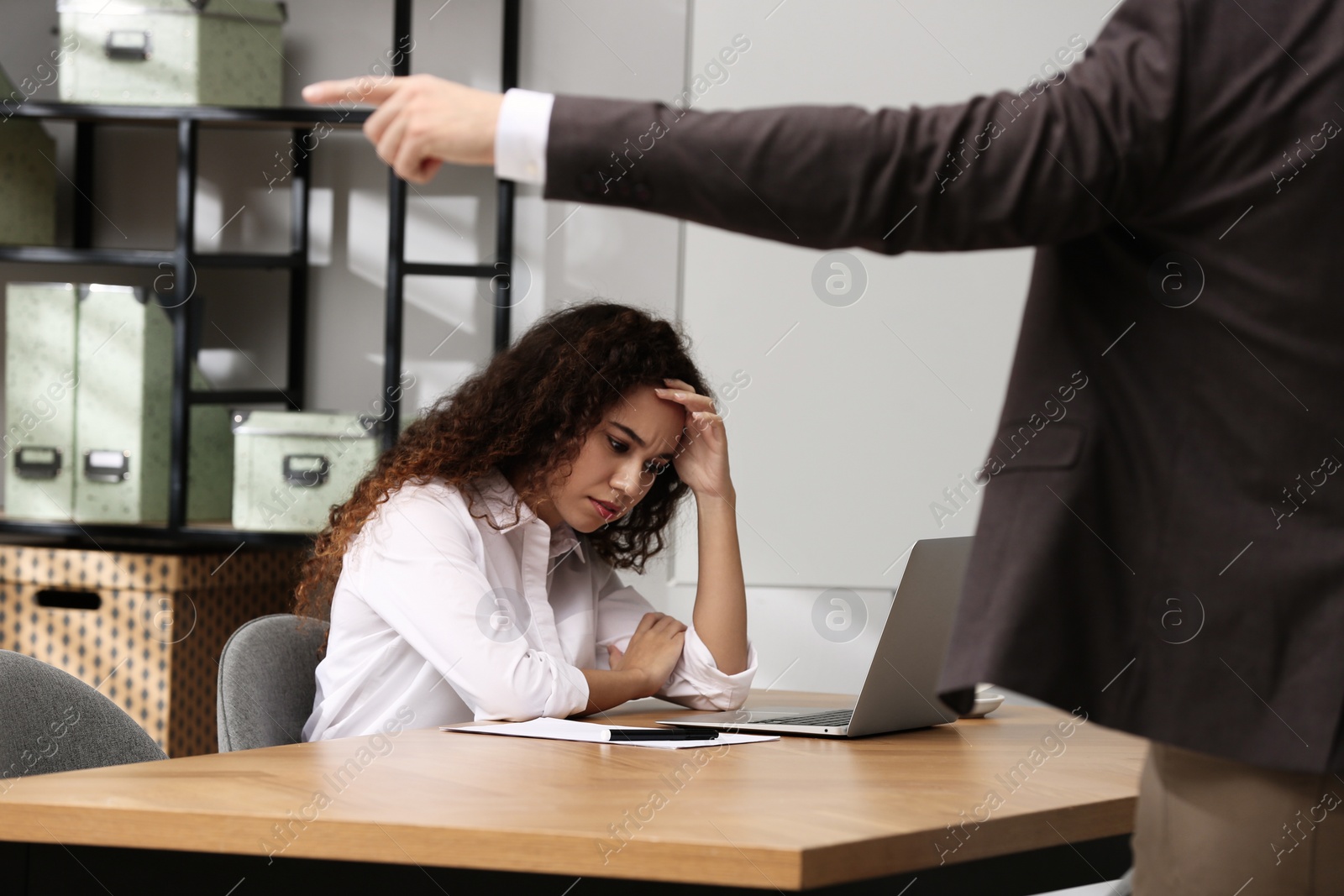 Photo of African American woman suffering from racial discrimination at work