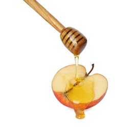 Photo of Pouring tasty honey onto cut apple on white background