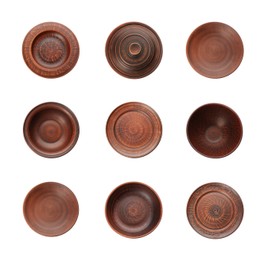 Image of Set with clay dishes on white background, top view