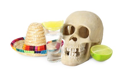 Mexican sombrero hat, human scull and tequila with lime isolated on white