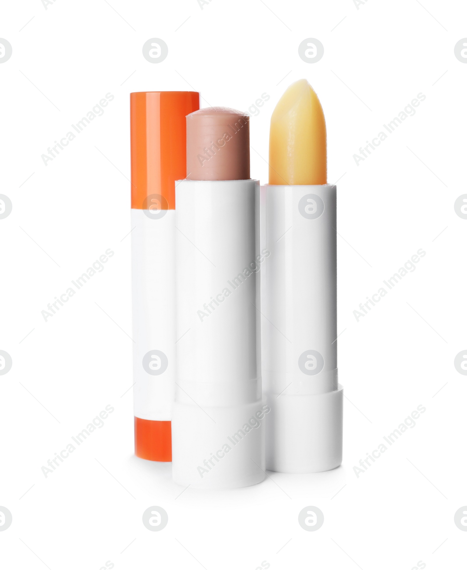 Photo of Sun protection lip balms on white background
