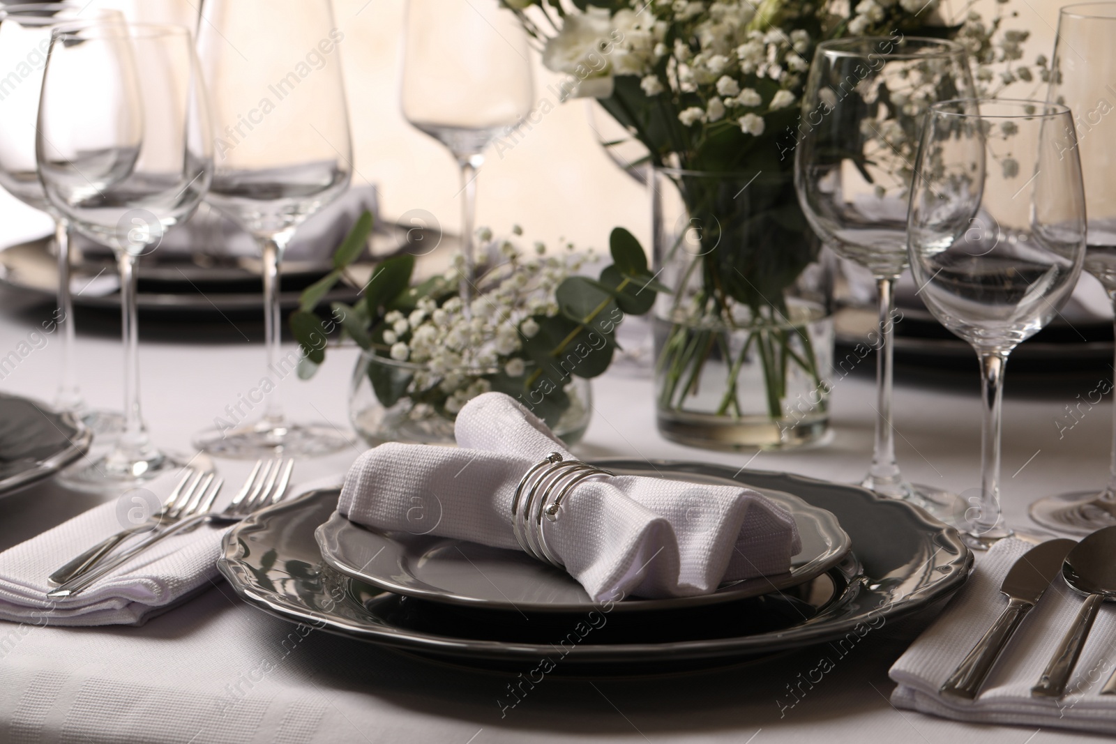 Photo of Stylish elegant table setting for festive dinner in restaurant