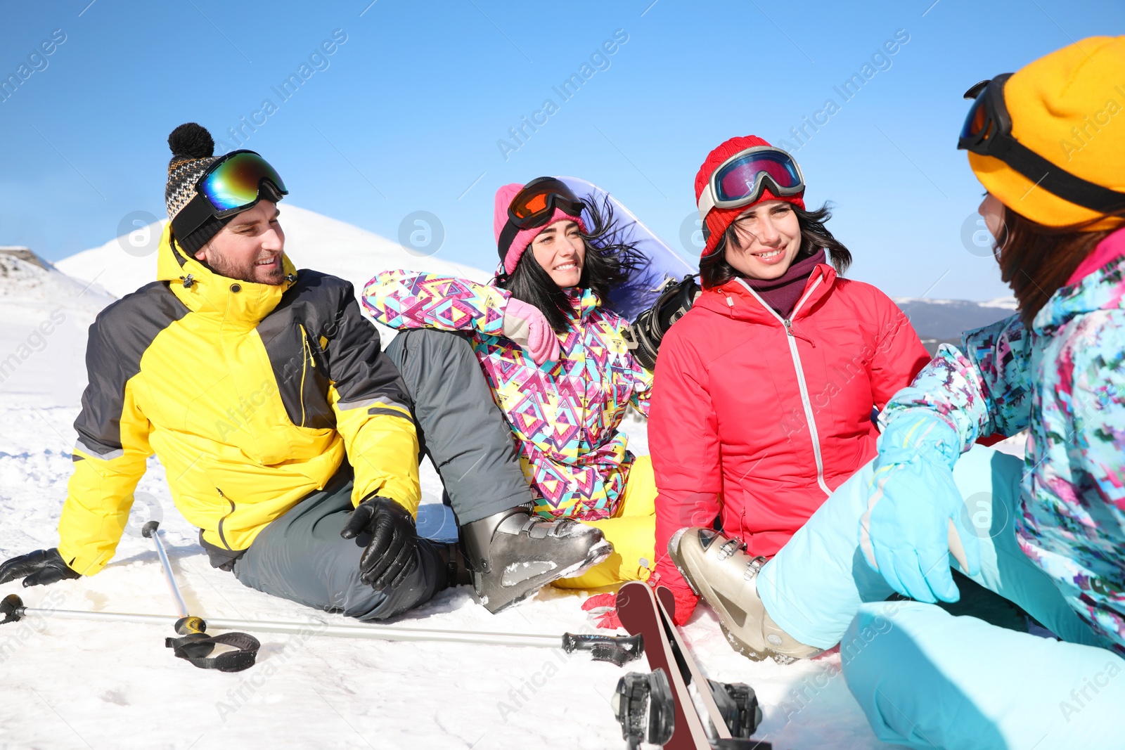 Photo of Group of friends with equipment at ski resort. Winter vacation