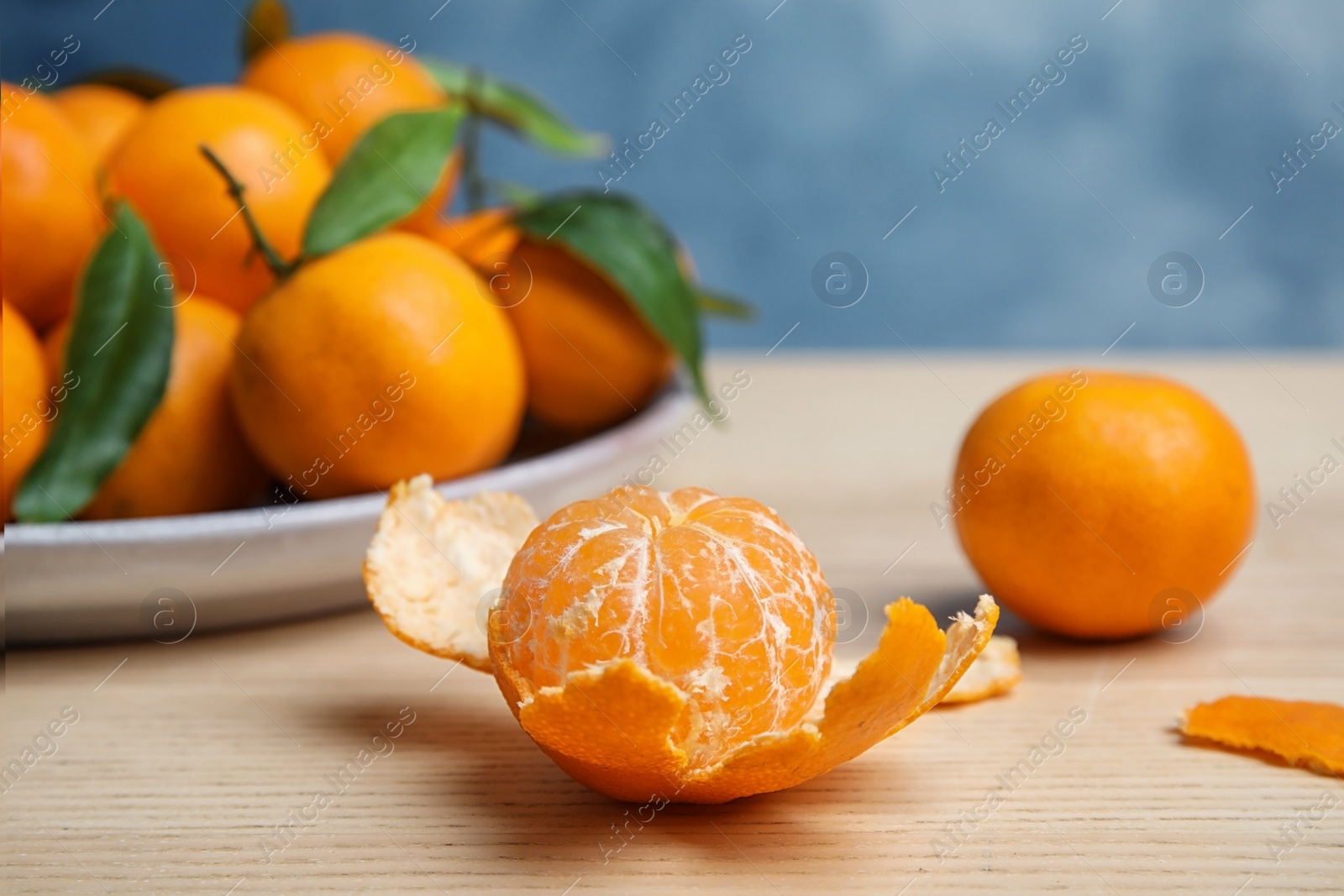 Photo of Fresh ripe tangerines on table. Citrus fruit