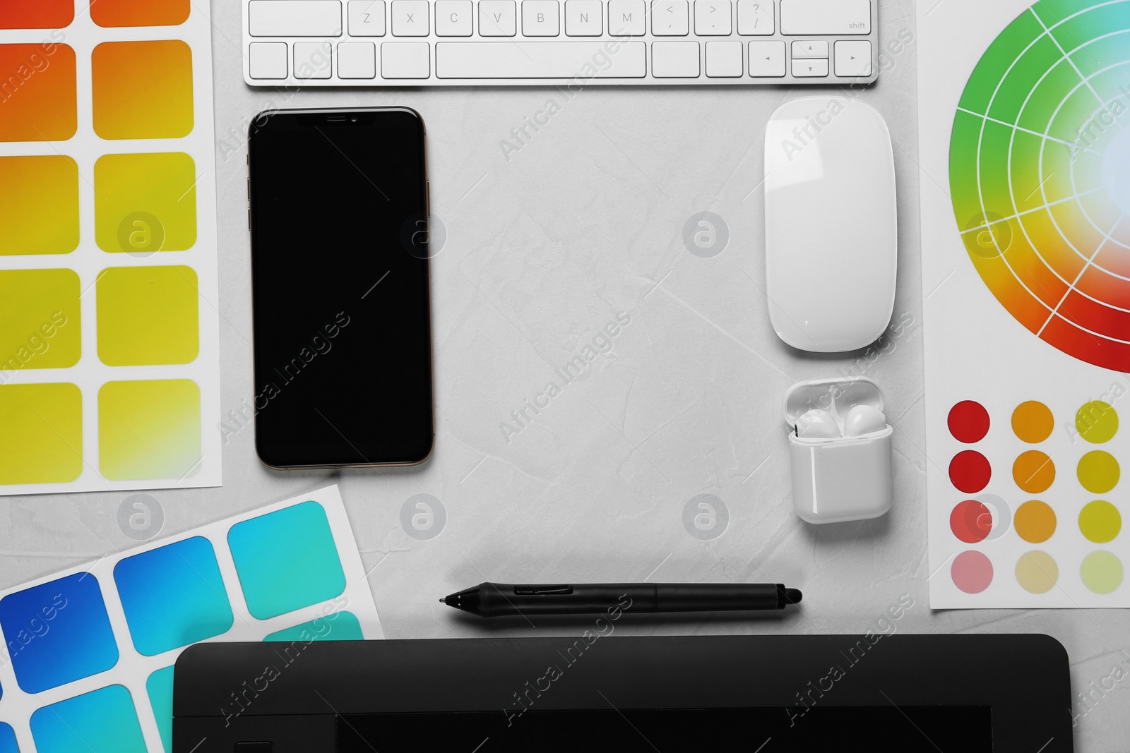 Photo of Flat lay composition with digital devices and color palettes on white background, space for text. Graphic designer's workplace