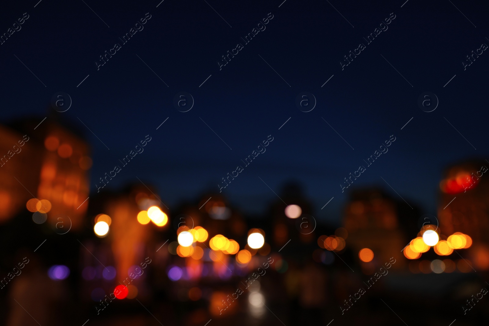 Photo of Blurred view of beautiful city at night. Bokeh effect