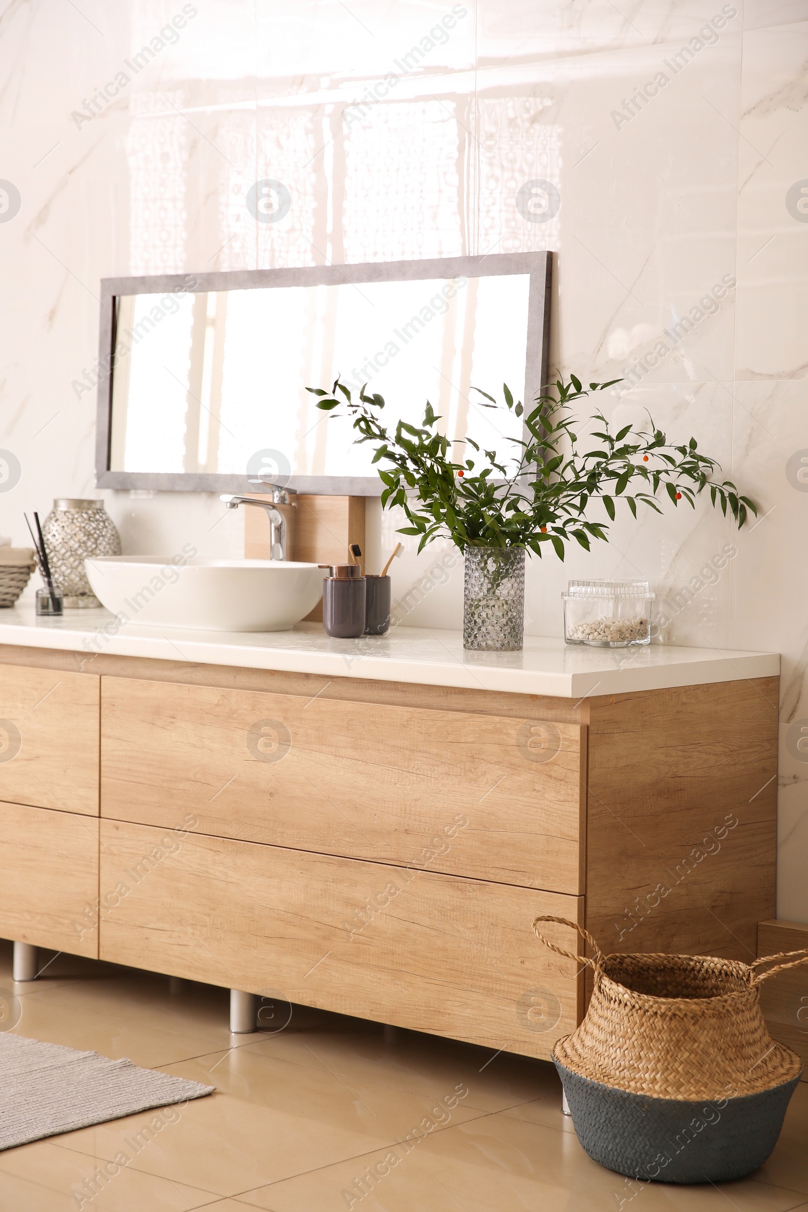 Photo of Modern bathroom interior with stylish mirror and vessel sink