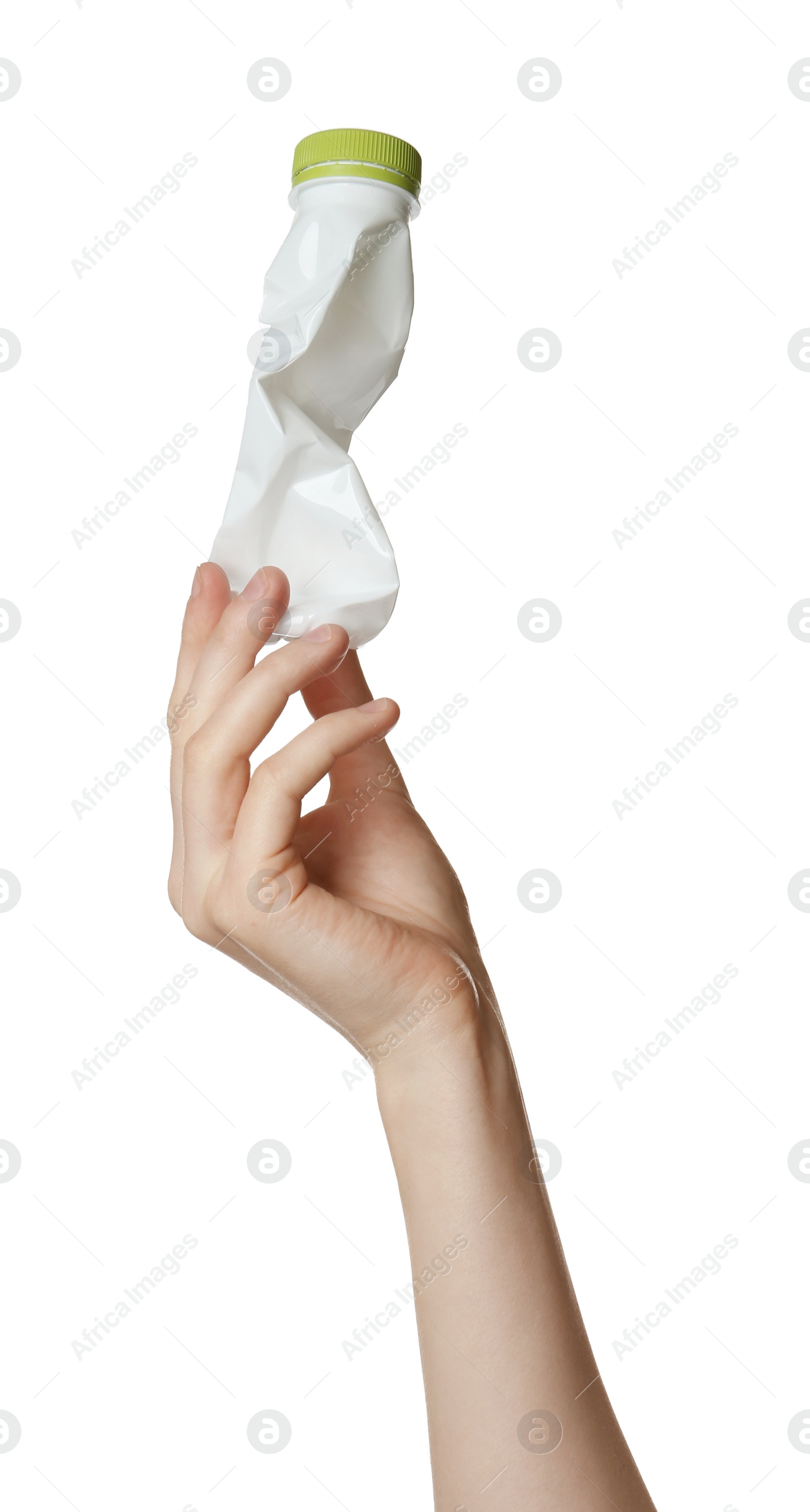 Photo of Woman holding crumpled plastic bottle on white background, closeup