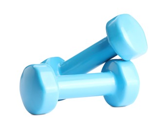 Photo of Light blue dumbbells isolated on white. Sports equipment