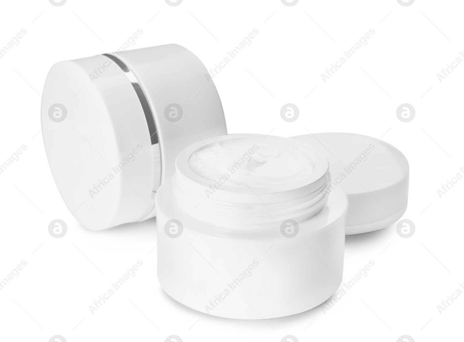 Photo of Jars of luxury face creams isolated on white