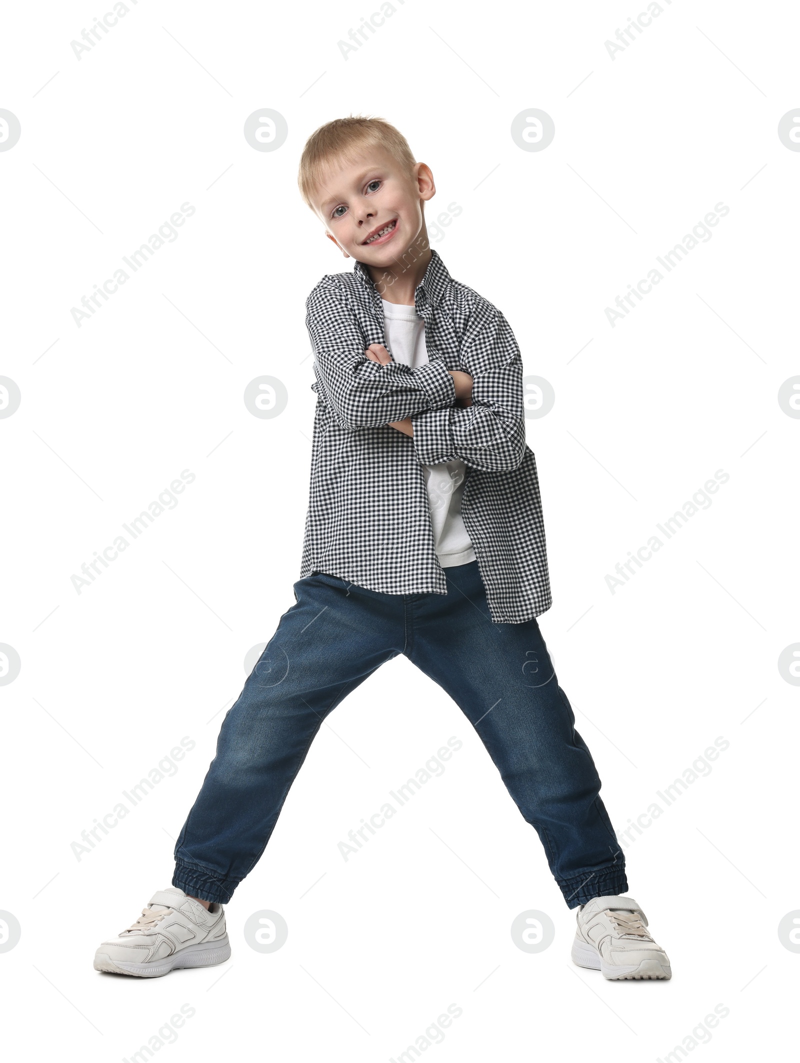 Photo of Happy little boy dancing on white background