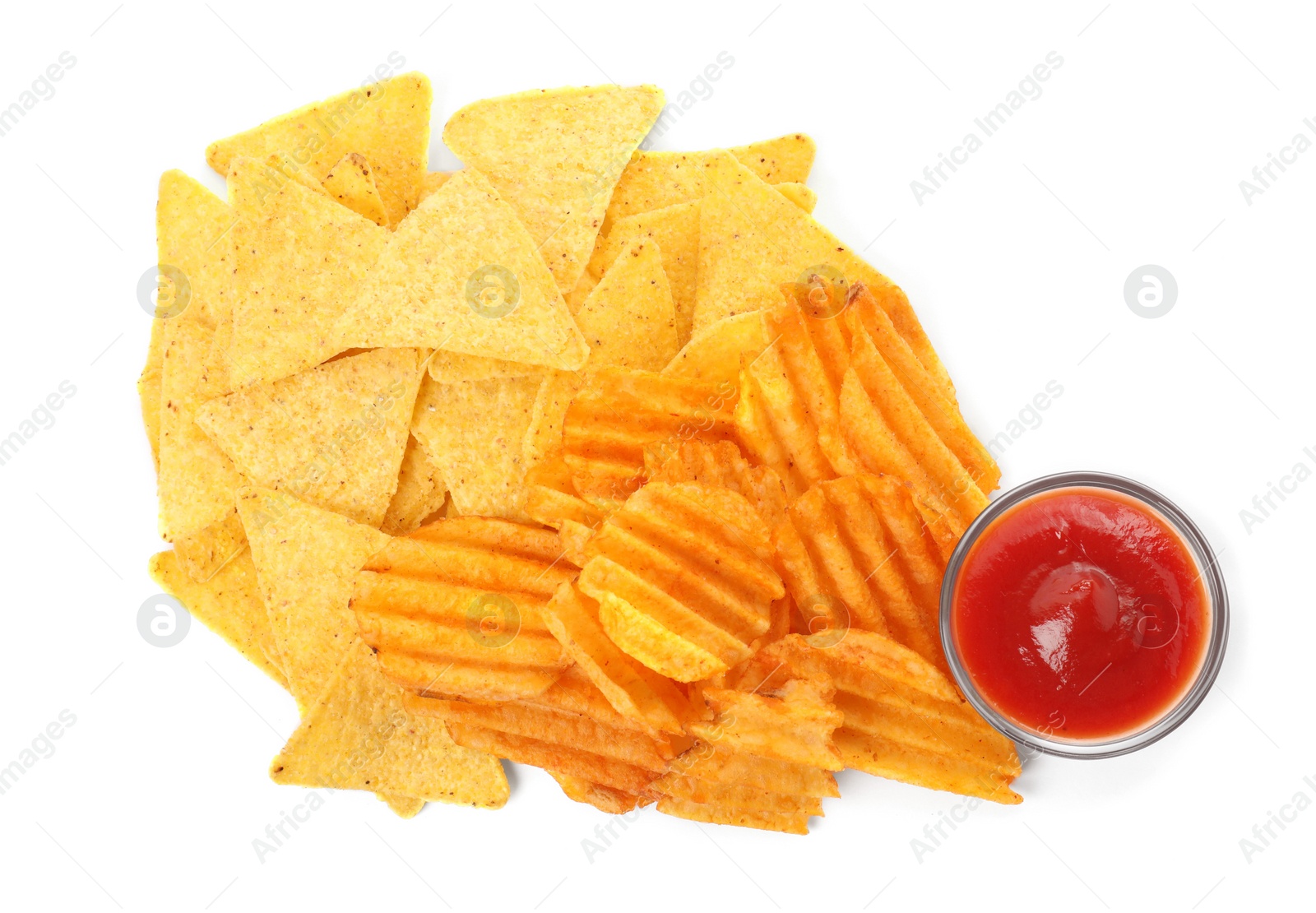 Photo of Tasty tortilla and ridged chips with ketchup on white background, top view