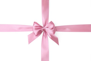 Photo of Pink satin ribbon with bow on white background, top view