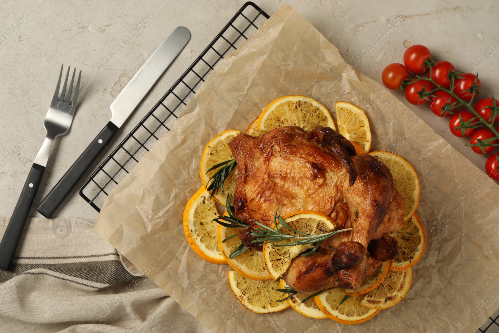 Photo of Chicken with orange slices on light grey table