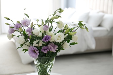 Photo of Beautiful bouquet with Eustoma flowers in bedroom