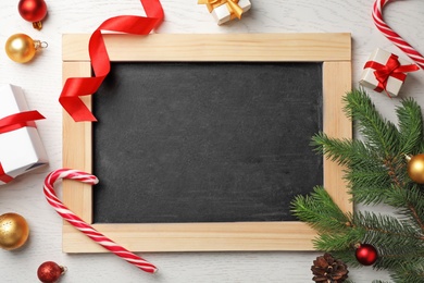 Photo of Chalkboard and decor on wooden background, top view. Christmas countdown