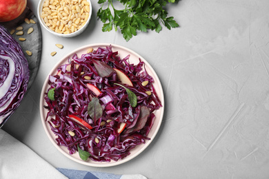 Fresh red cabbage salad served on light grey table, flat lay. Space for text