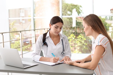 Patient having appointment with doctor in hospital