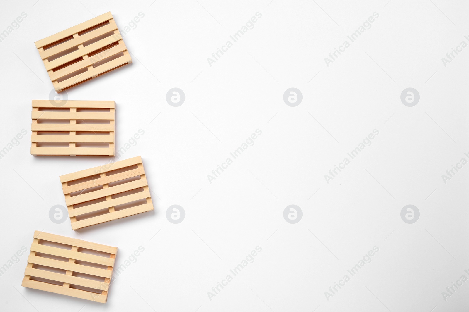 Photo of Wooden pallets on white background, top view