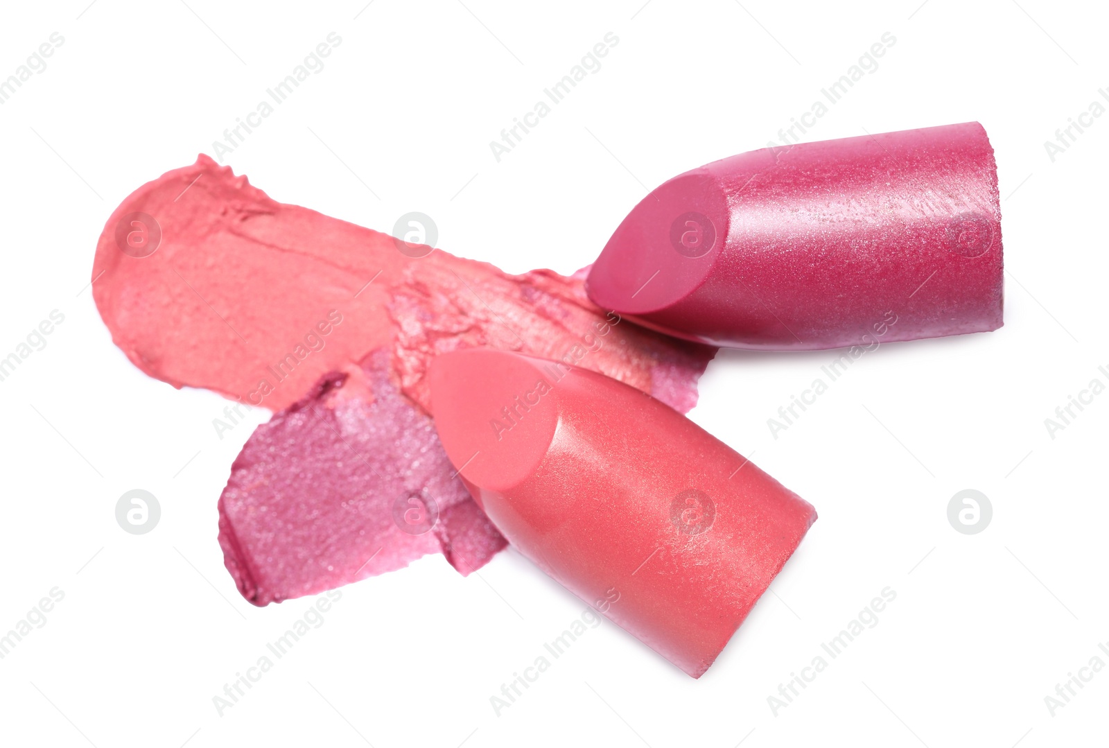 Photo of Different bright lipsticks and smears on white background