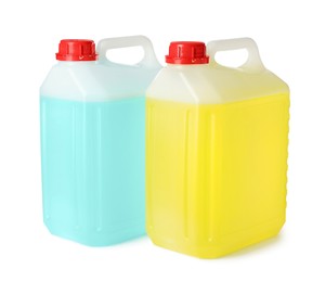 Plastic canisters with liquids on white background
