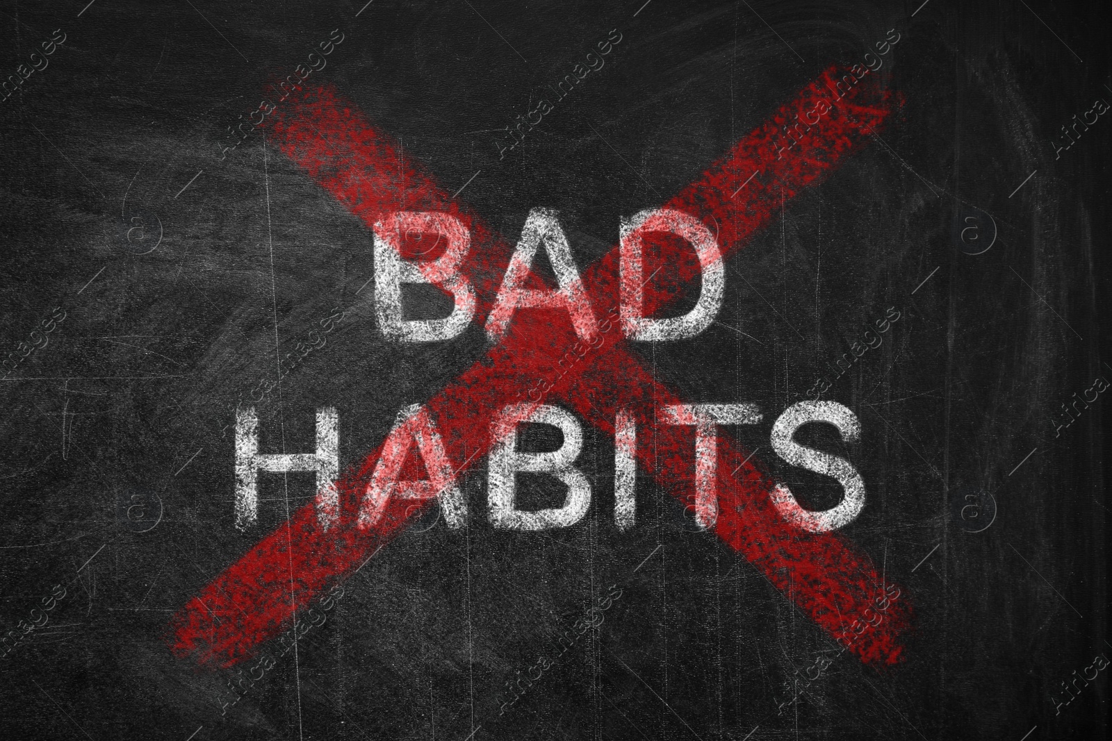 Image of Phrase Bad Habits crossed with red lines on blackboard