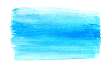 Blue paint stroke drawn with brush on white background, top view